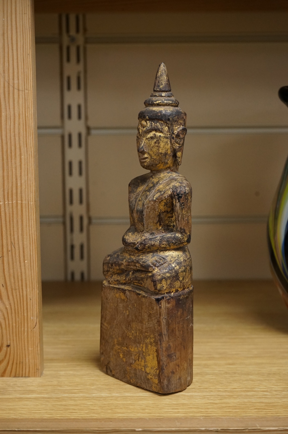 A Burmese giltwood figure of seated Buddha, 24cm high